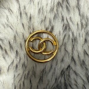 CHANEL Gold Interlocking Logo Brooch